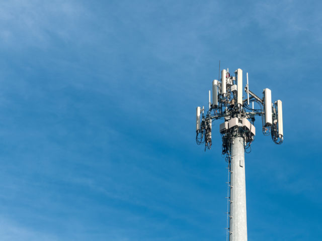 cell tower against a clear blue sky
