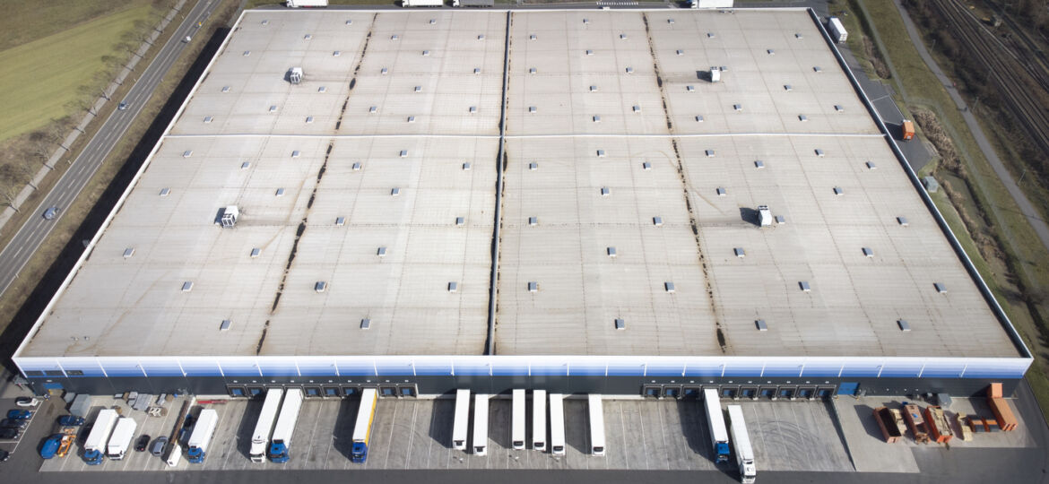 An aerial photo of commercial warehouse rooftop.