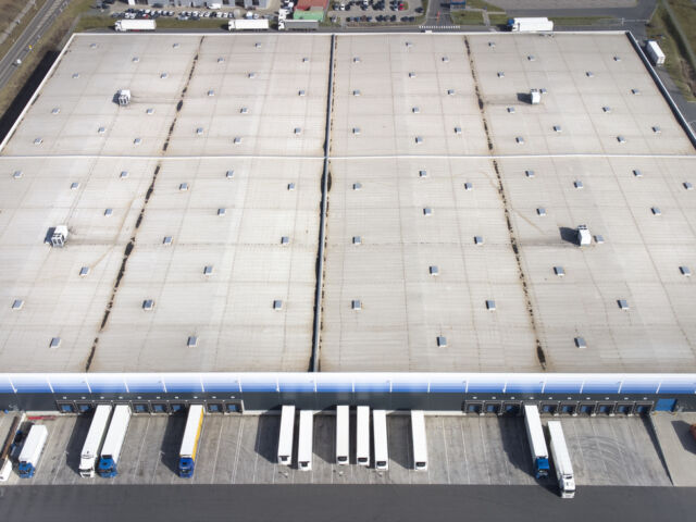 An aerial photo of commercial warehouse rooftop.