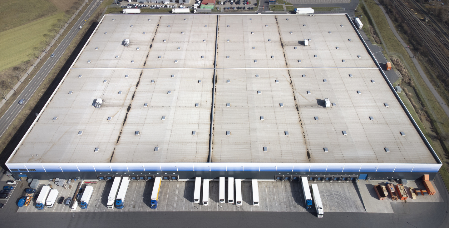 An aerial photo of commercial warehouse rooftop.