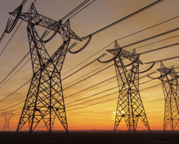 A photo of power poles during a sunset