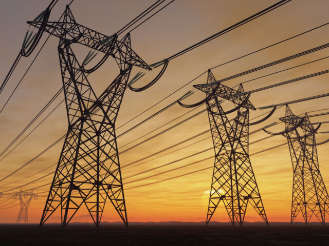 A photo of power poles during a sunset