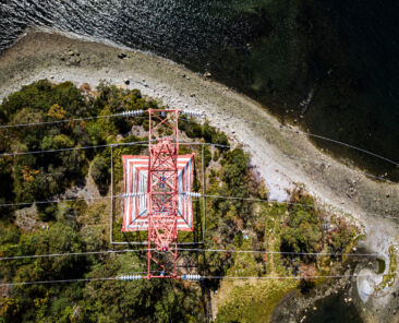 Aerial drone view of a high voltage power pylon.